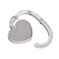 Gancho Porta Carteras plegable metalico forma de corazón, 5 cmts diametro